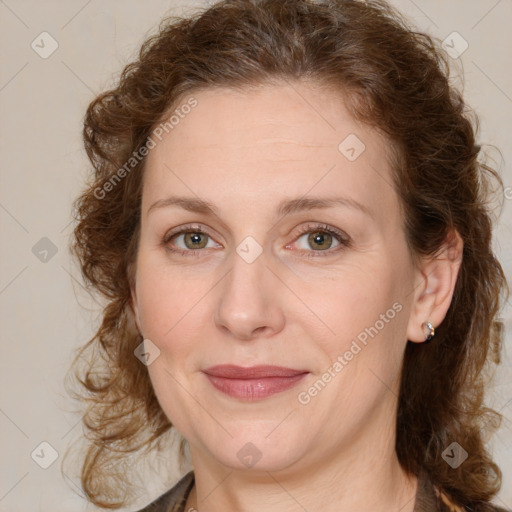 Joyful white young-adult female with medium  brown hair and green eyes