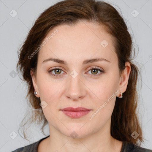 Joyful white young-adult female with medium  brown hair and green eyes