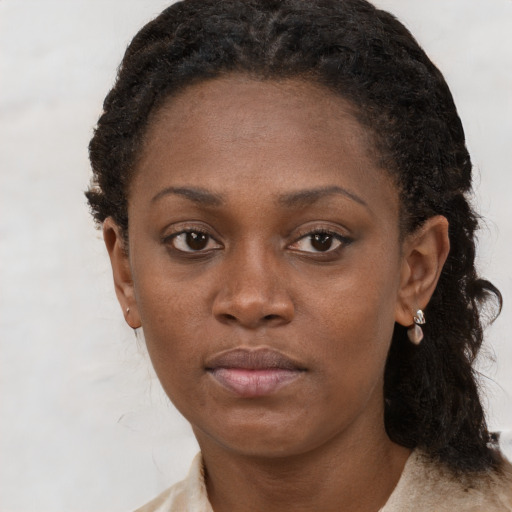 Neutral black young-adult female with short  brown hair and brown eyes