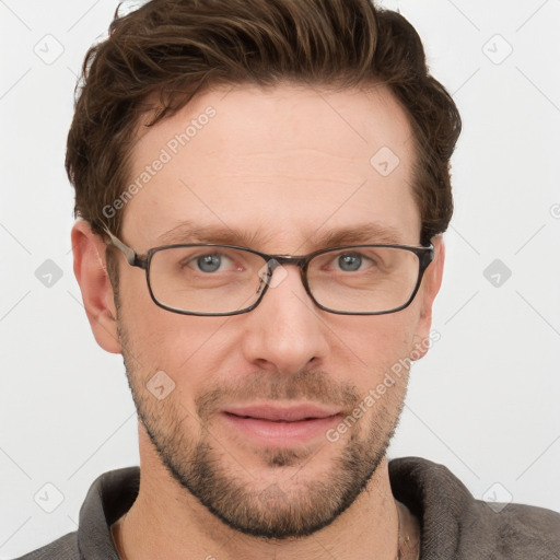 Joyful white adult male with short  brown hair and grey eyes