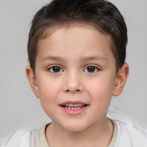 Joyful white child male with short  brown hair and brown eyes