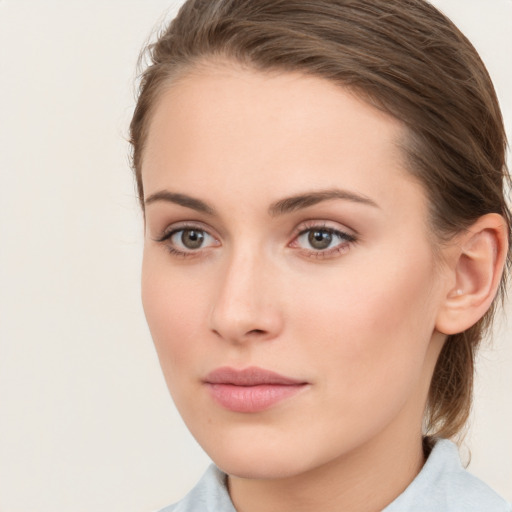 Neutral white young-adult female with medium  brown hair and brown eyes