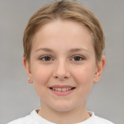 Joyful white child female with short  brown hair and brown eyes