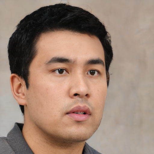 Neutral asian young-adult male with short  black hair and brown eyes