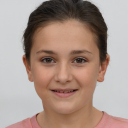 Joyful white child female with short  brown hair and brown eyes