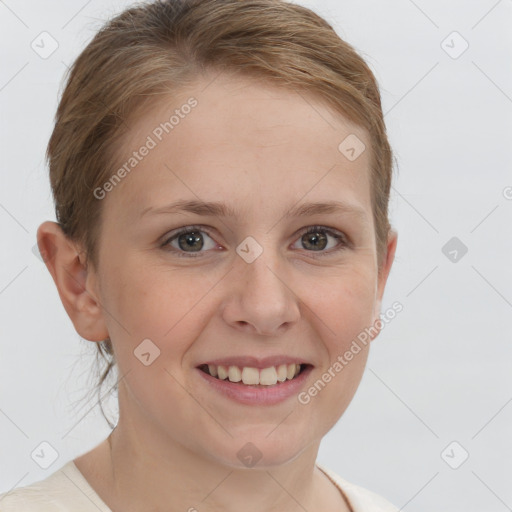 Joyful white young-adult female with short  brown hair and grey eyes