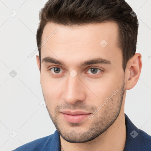 Neutral white young-adult male with short  brown hair and brown eyes