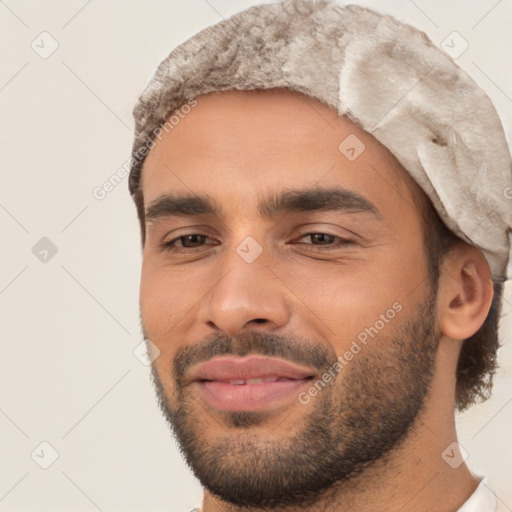 Joyful white young-adult male with short  black hair and brown eyes