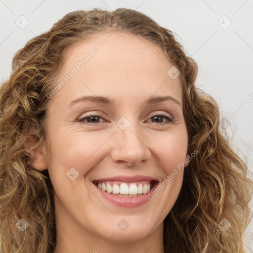 Joyful white young-adult female with long  brown hair and green eyes