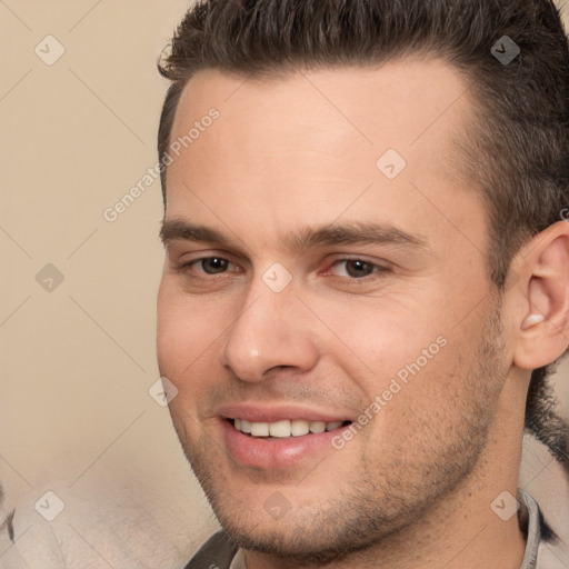 Joyful white young-adult male with short  brown hair and brown eyes