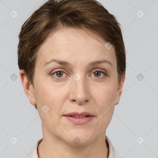 Joyful white adult female with short  brown hair and grey eyes