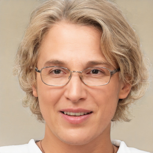 Joyful white middle-aged female with medium  brown hair and brown eyes