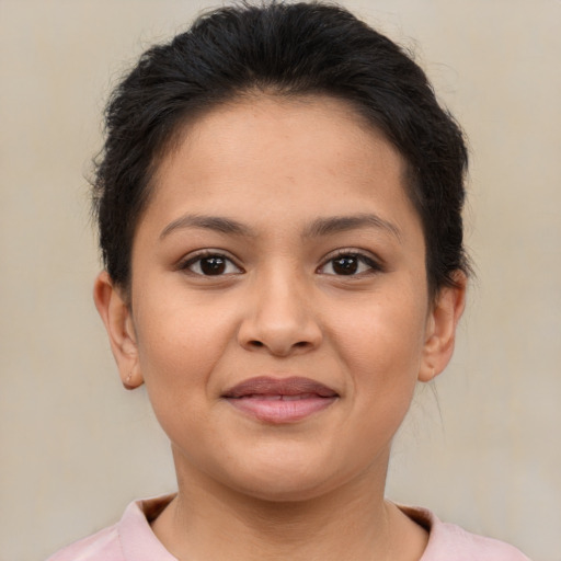 Joyful latino young-adult female with short  brown hair and brown eyes