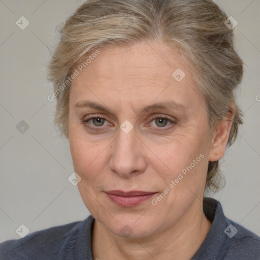 Joyful white adult female with medium  brown hair and grey eyes