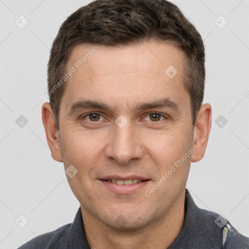 Joyful white adult male with short  brown hair and brown eyes