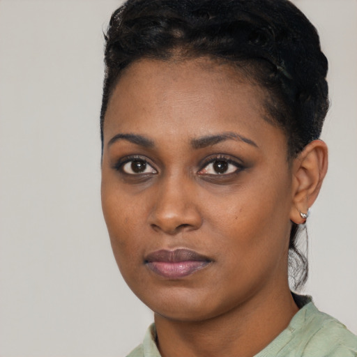 Neutral black young-adult female with short  black hair and brown eyes