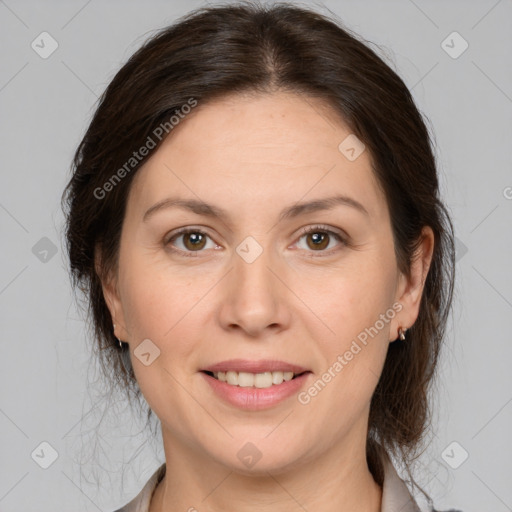 Joyful white adult female with medium  brown hair and brown eyes