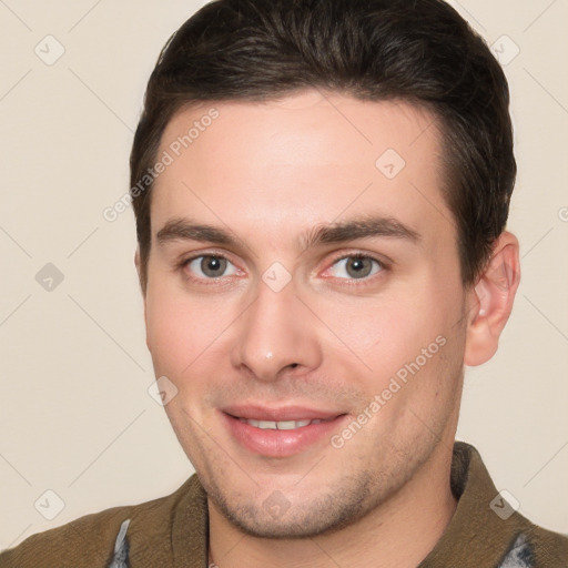 Joyful white young-adult male with short  brown hair and brown eyes