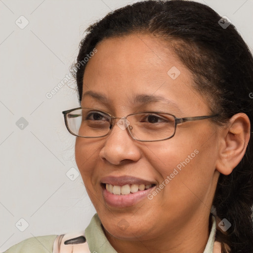 Joyful white adult female with medium  brown hair and brown eyes