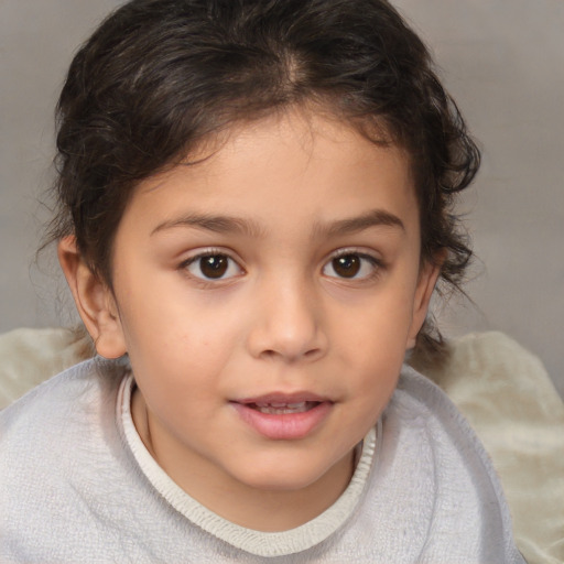 Joyful white child female with medium  brown hair and brown eyes