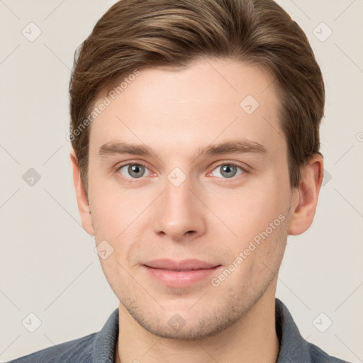 Joyful white young-adult male with short  brown hair and grey eyes