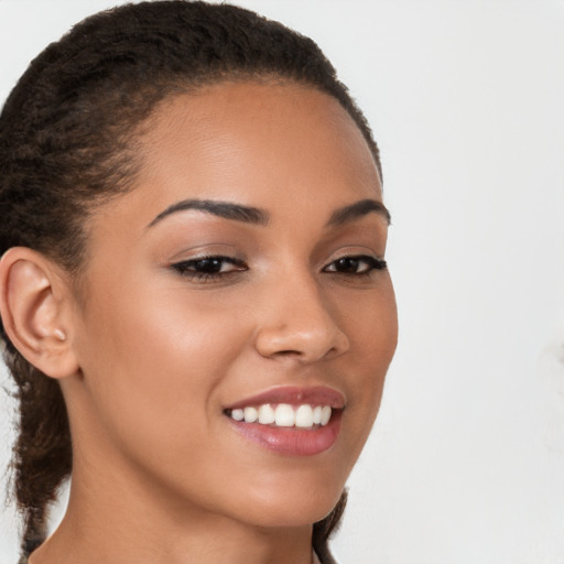 Joyful latino young-adult female with medium  brown hair and brown eyes