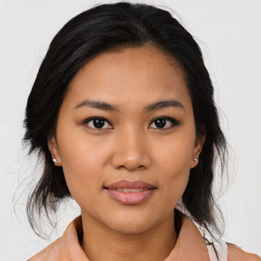 Joyful asian young-adult female with medium  black hair and brown eyes