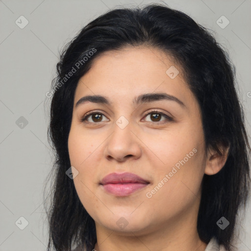 Joyful latino young-adult female with long  brown hair and brown eyes