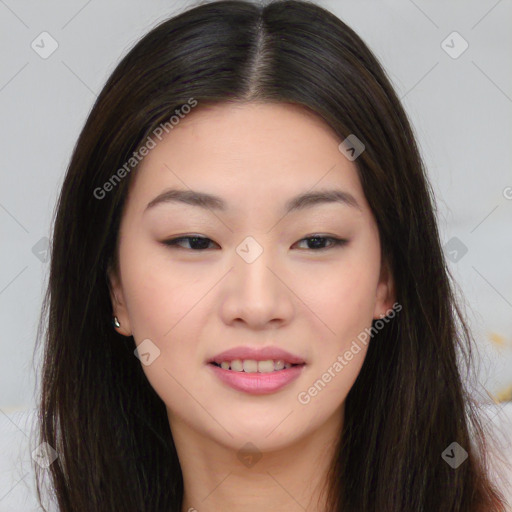 Joyful asian young-adult female with long  brown hair and brown eyes