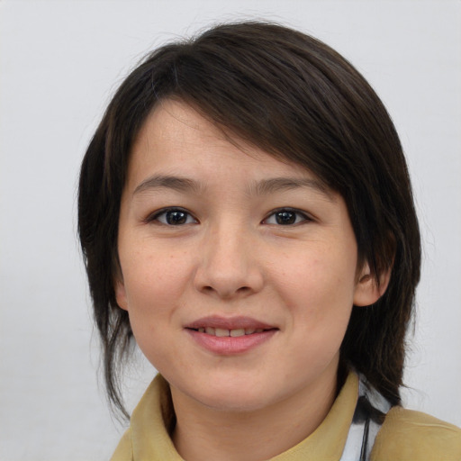 Joyful asian young-adult female with medium  brown hair and brown eyes