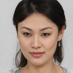 Joyful asian young-adult female with medium  brown hair and brown eyes