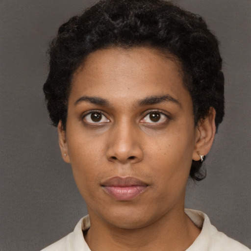 Neutral black young-adult female with short  black hair and brown eyes