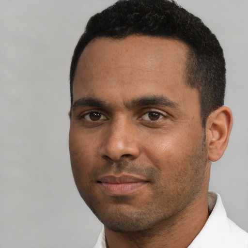 Neutral black young-adult male with short  black hair and brown eyes
