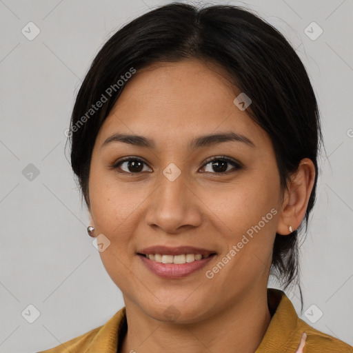 Joyful latino young-adult female with medium  brown hair and brown eyes