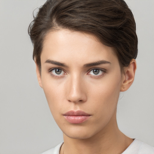 Neutral white young-adult female with short  brown hair and brown eyes