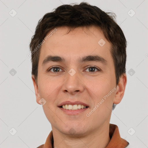 Joyful white young-adult male with short  brown hair and brown eyes