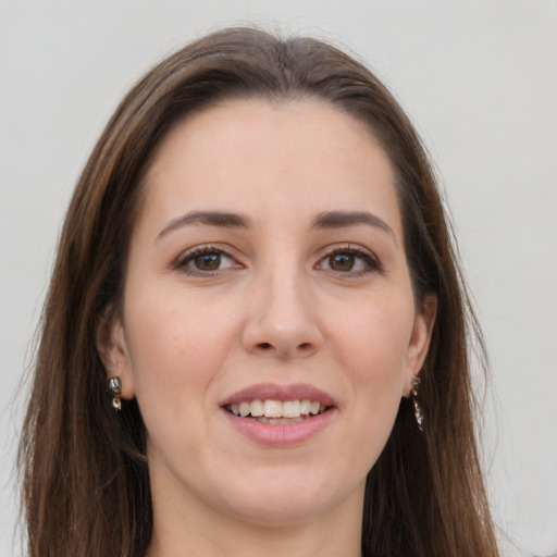 Joyful white young-adult female with long  brown hair and grey eyes