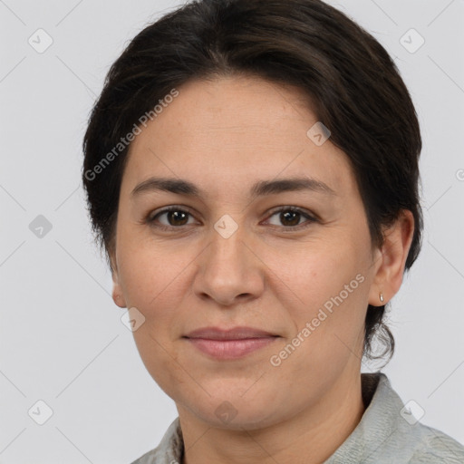 Joyful white adult female with short  brown hair and brown eyes