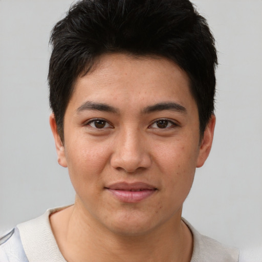 Joyful asian young-adult male with short  brown hair and brown eyes