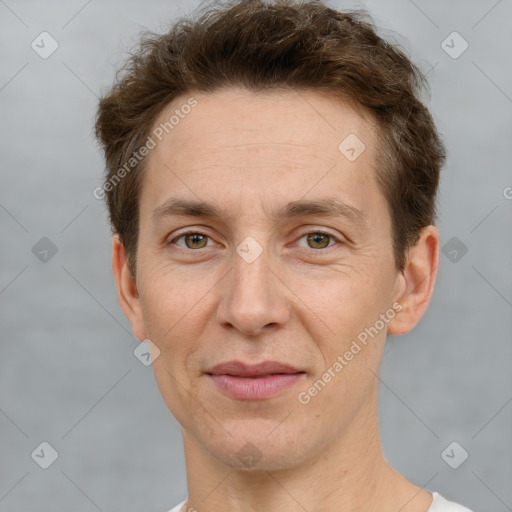 Joyful white adult male with short  brown hair and grey eyes