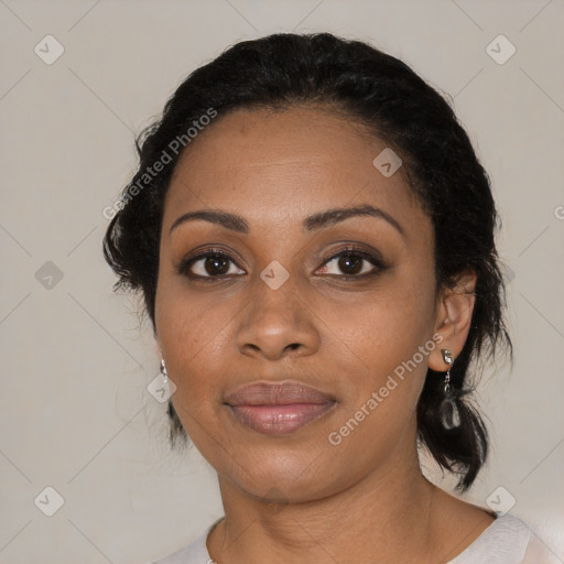 Joyful black adult female with medium  black hair and brown eyes