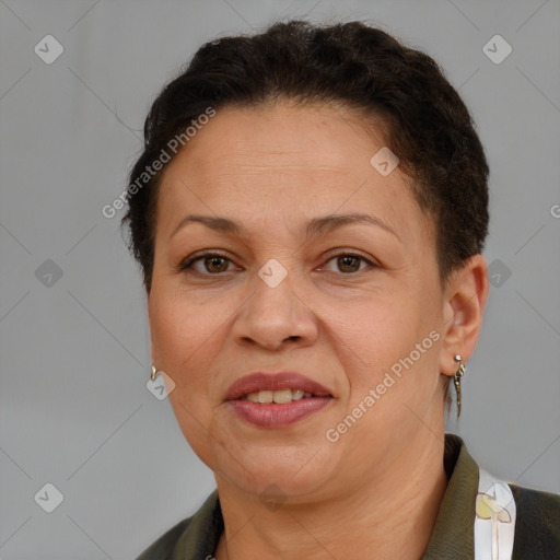 Joyful latino adult female with short  brown hair and brown eyes