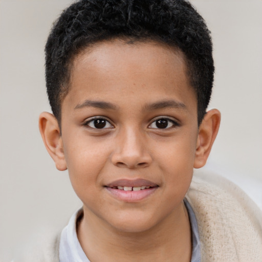 Joyful latino child male with short  brown hair and brown eyes