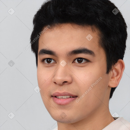 Joyful asian young-adult male with short  black hair and brown eyes