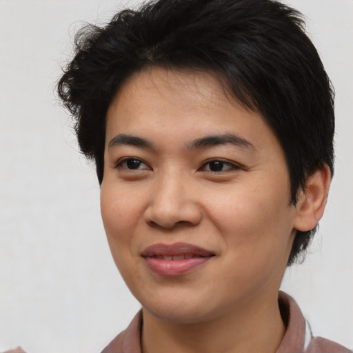 Joyful asian young-adult female with short  brown hair and brown eyes