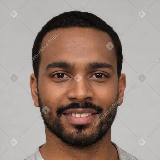 Joyful black young-adult male with short  black hair and brown eyes