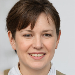 Joyful white adult female with short  brown hair and brown eyes