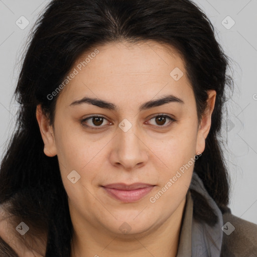 Joyful latino young-adult female with long  brown hair and brown eyes