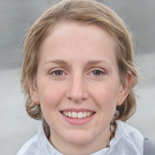 Joyful white young-adult female with medium  brown hair and blue eyes