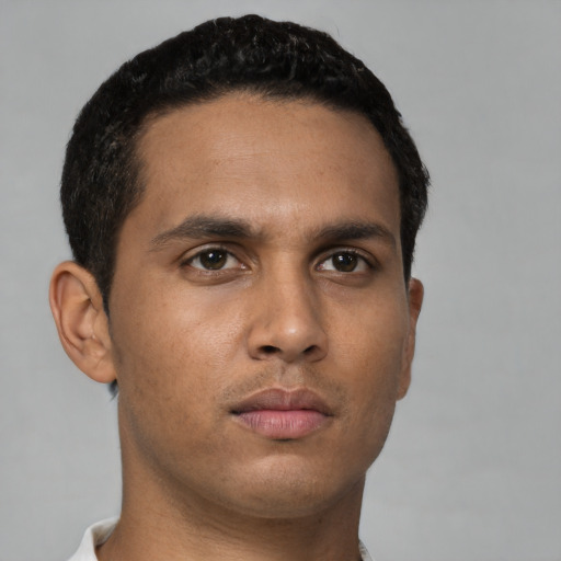 Neutral latino young-adult male with short  brown hair and brown eyes